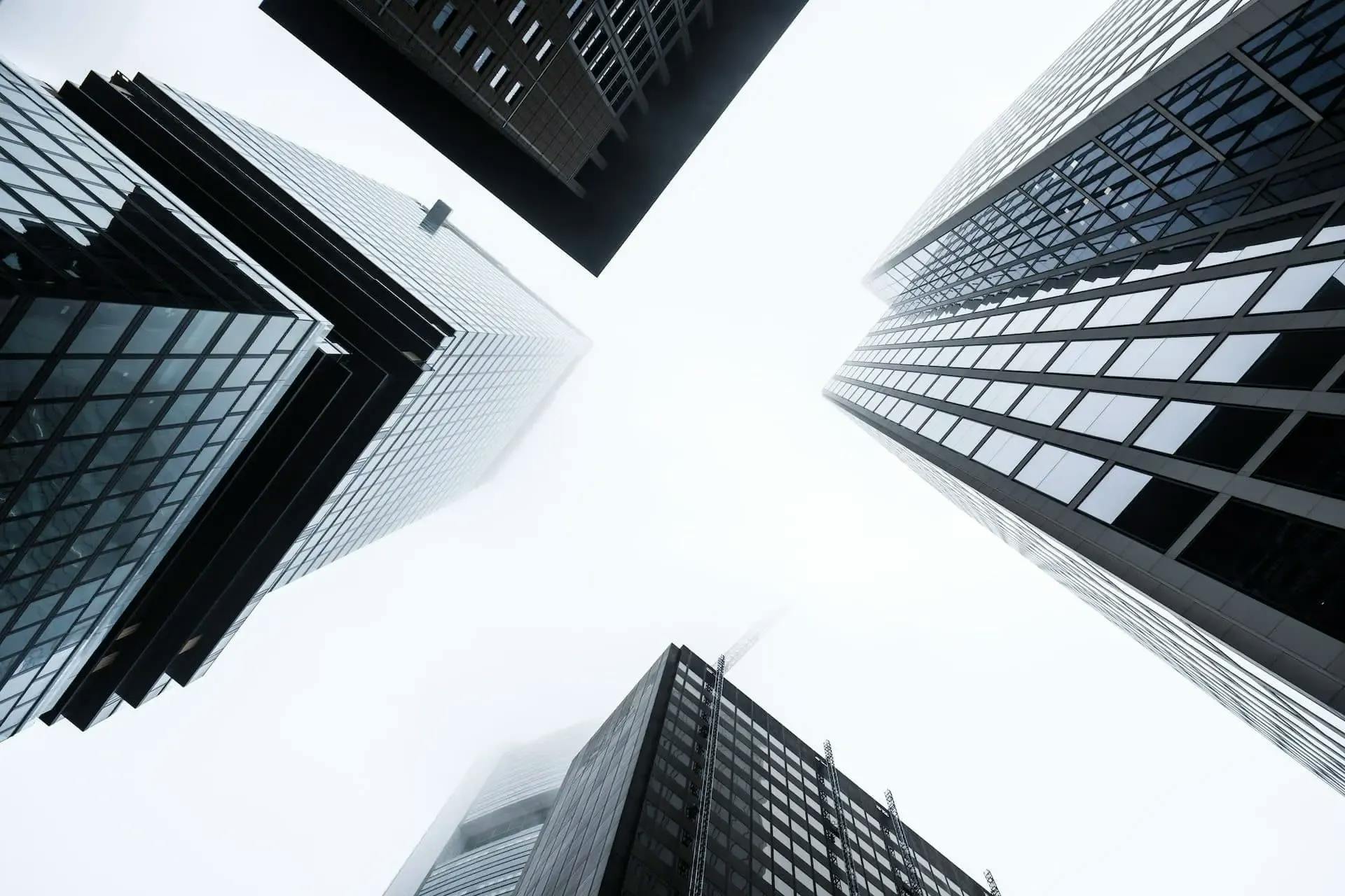 looking up view of tall buildings